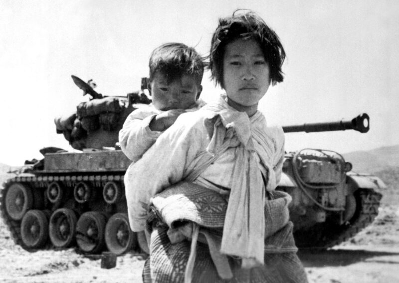 1951, Korean refugees in front of a US M46 Patton tank during Korean War