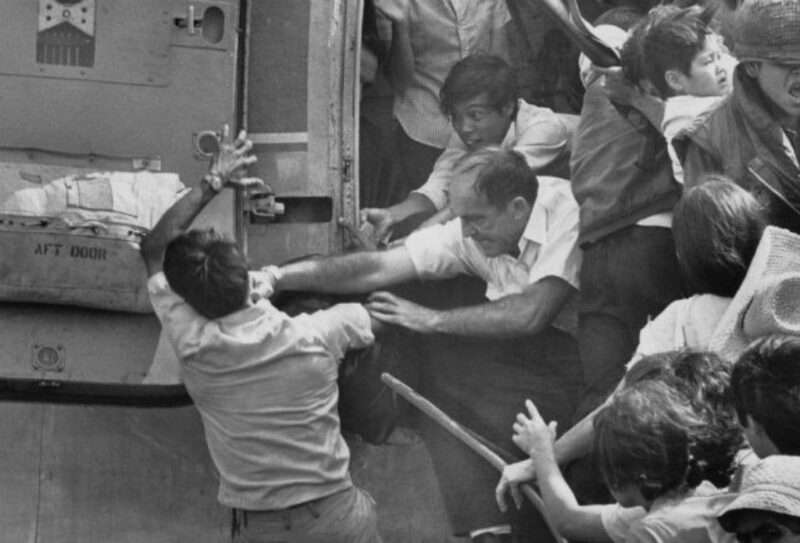 1975, An American evacuee punches a South Vietnamese man for a place on last chopper during Saigon evacuation